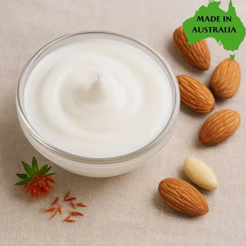 Jar of cream with almonds and a 'Made in Australia' label on a beige background