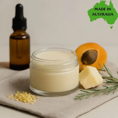 Jar of lip stick base with a dropper bottle, apricot, and seeds on a neutral background with 'Made in Australia' label.