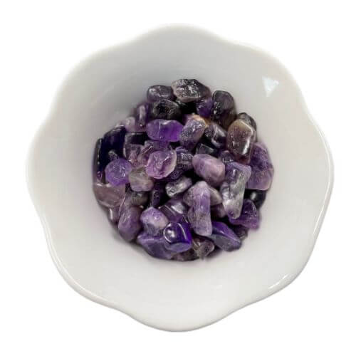 White bowl with purple amethyst crystals in it