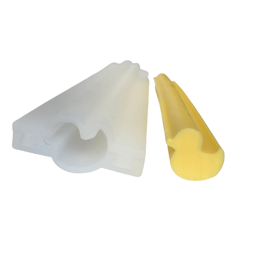 A silicone mould in two pieces that form a tube with a duck shape.