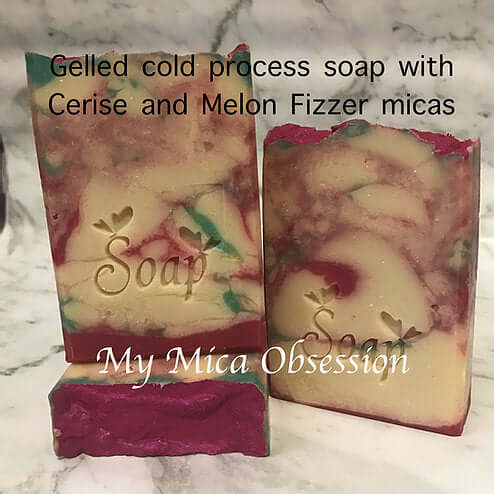 Melon fizzer mica and cerise mica making pink and green swirls in soap