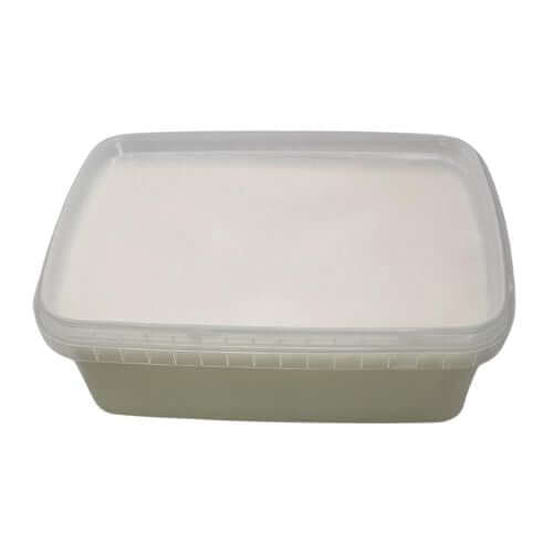 White soap block in clear container with lid