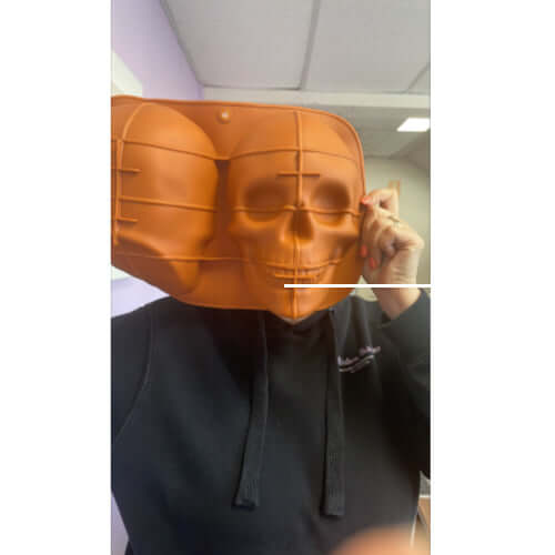 Skull mould over persons face to show size