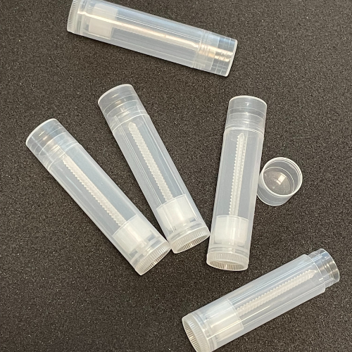 Clear Lip Balm Tubes on black background