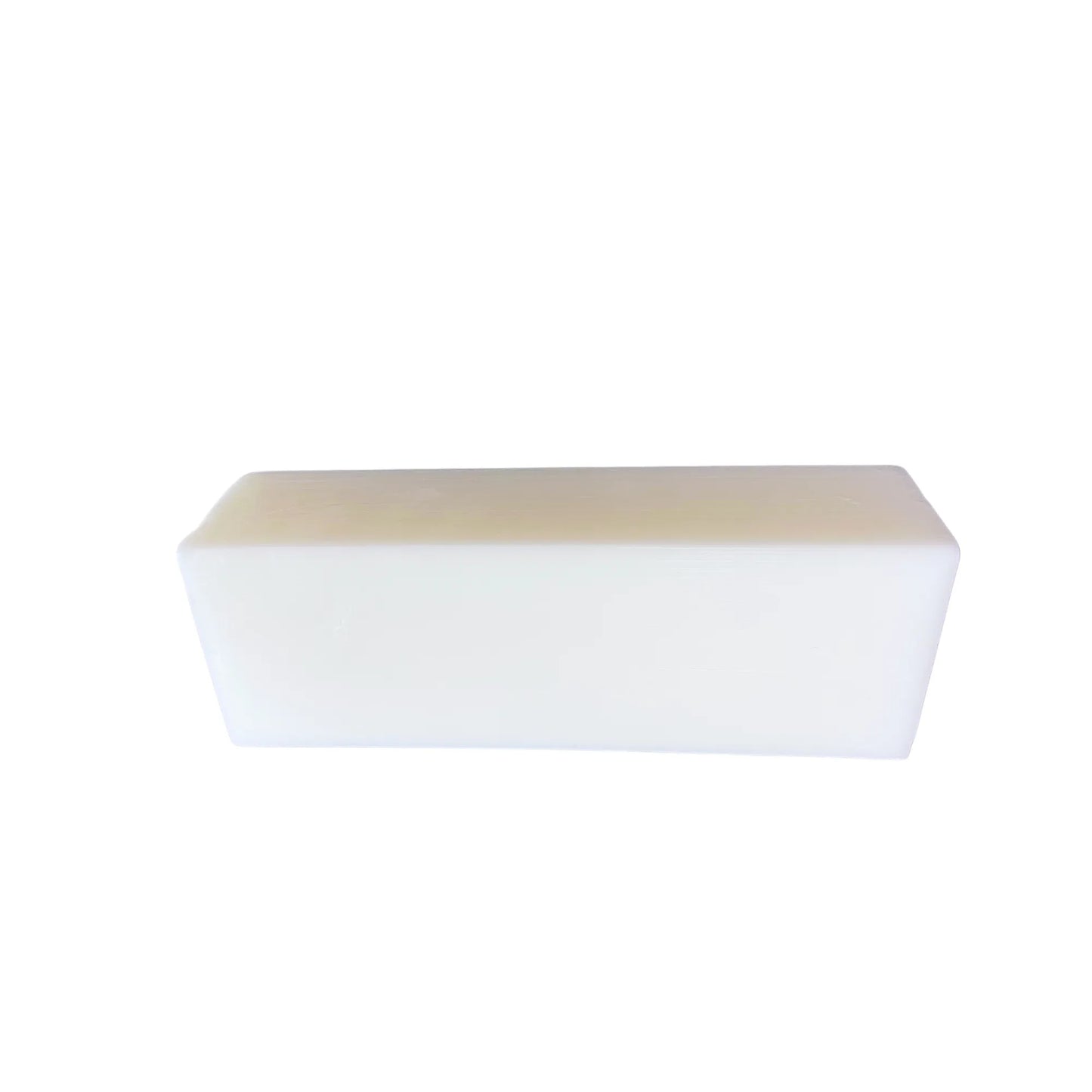 Rectangular white goat milk soap bar on white background