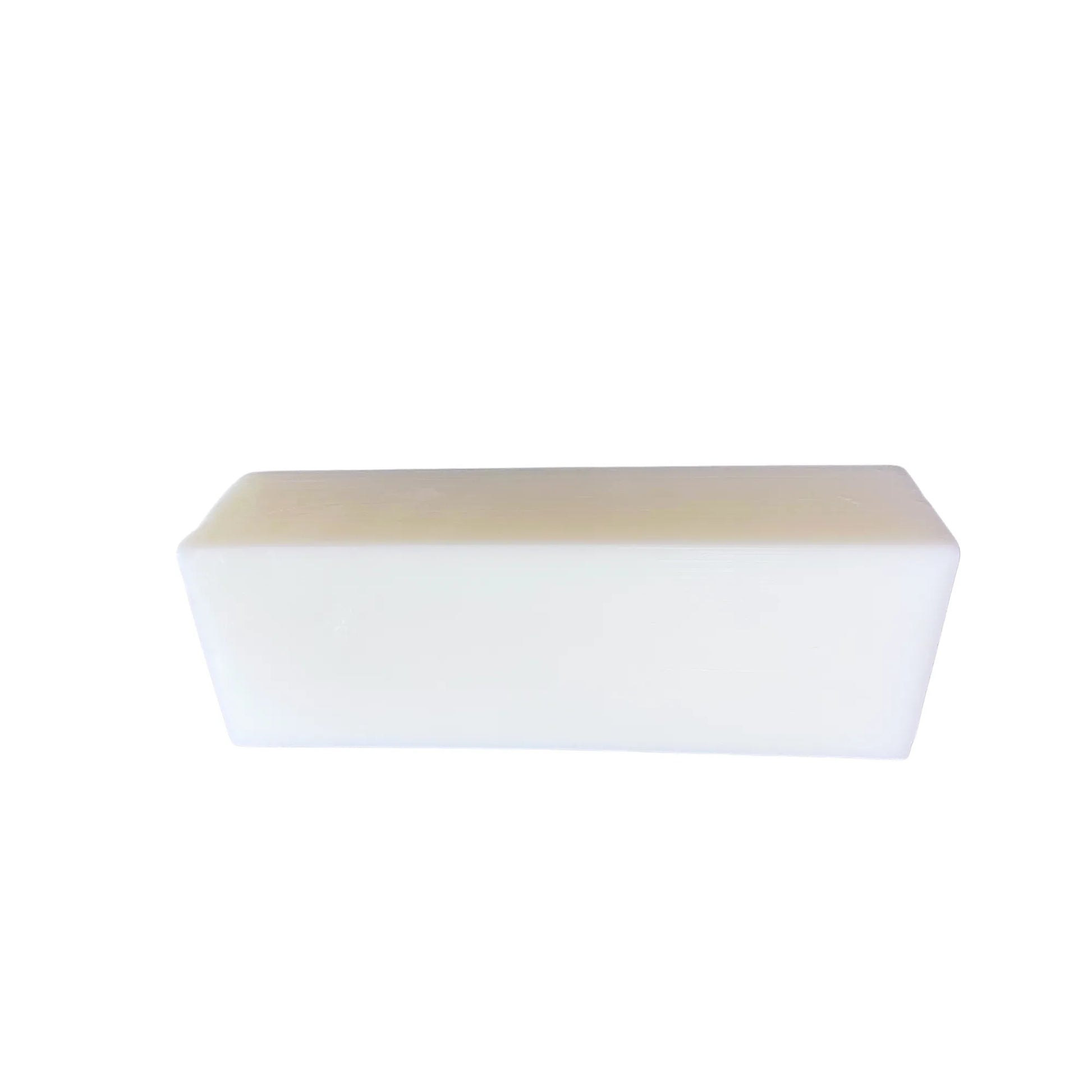 Rectangular white goat milk soap bar on white background
