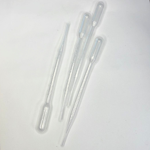 Clear plastic pipettes on a white background