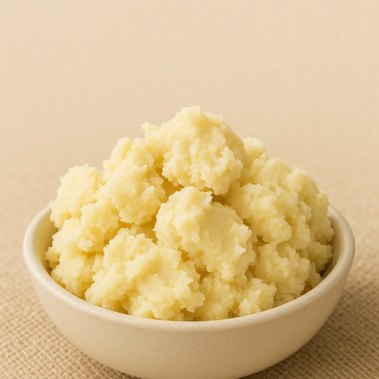 Unrefined shea butter in a white bowl