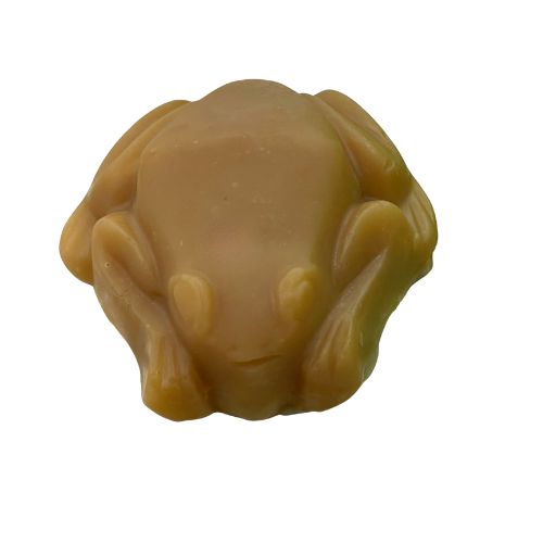 Beige-colored soap bar shaped like a frog on a white background showing the colour Versace Eros turns cold process soap