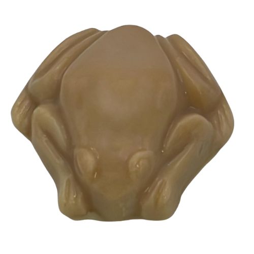 A tan frog shaped soap showing the colour Raspberry Dream Fragrance Oil turns it.