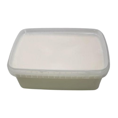 White soap block in clear container with lid