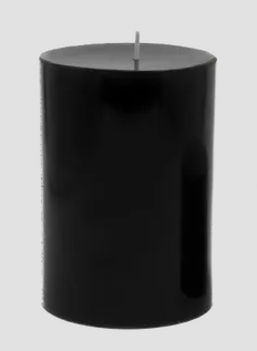 Black candle coloured with black candle dye chips