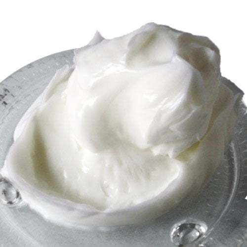 A white blob of Body Butter base Natural on a glass saucer