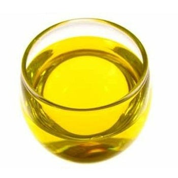 Jojoba Oil is golden yellow and in a clear glass