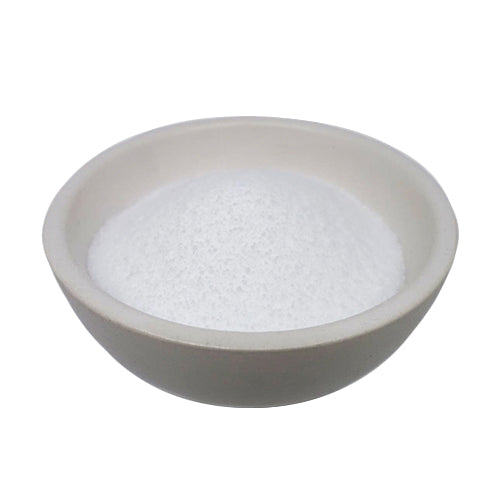 Stearic Acid (Palm derived) are white beads in a ceramic bowl