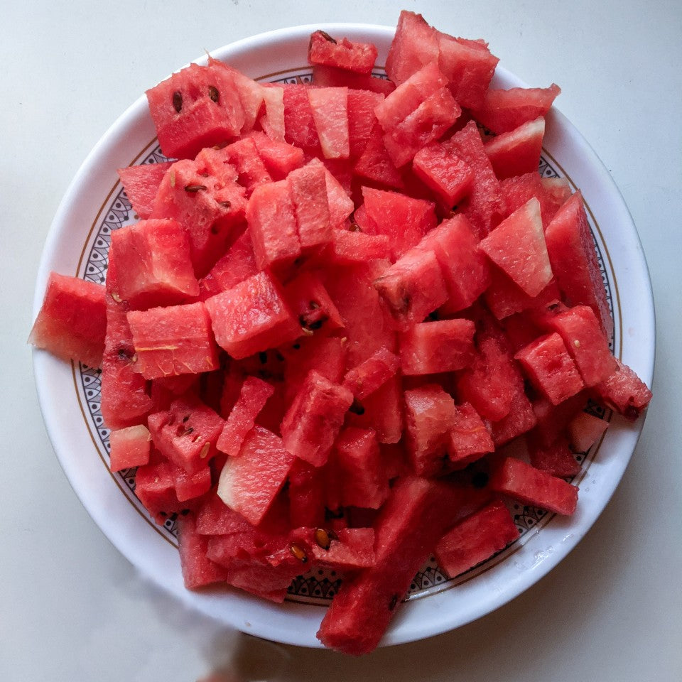 Watermelon Flavour Oil showing a big plate of juicy red watermelon